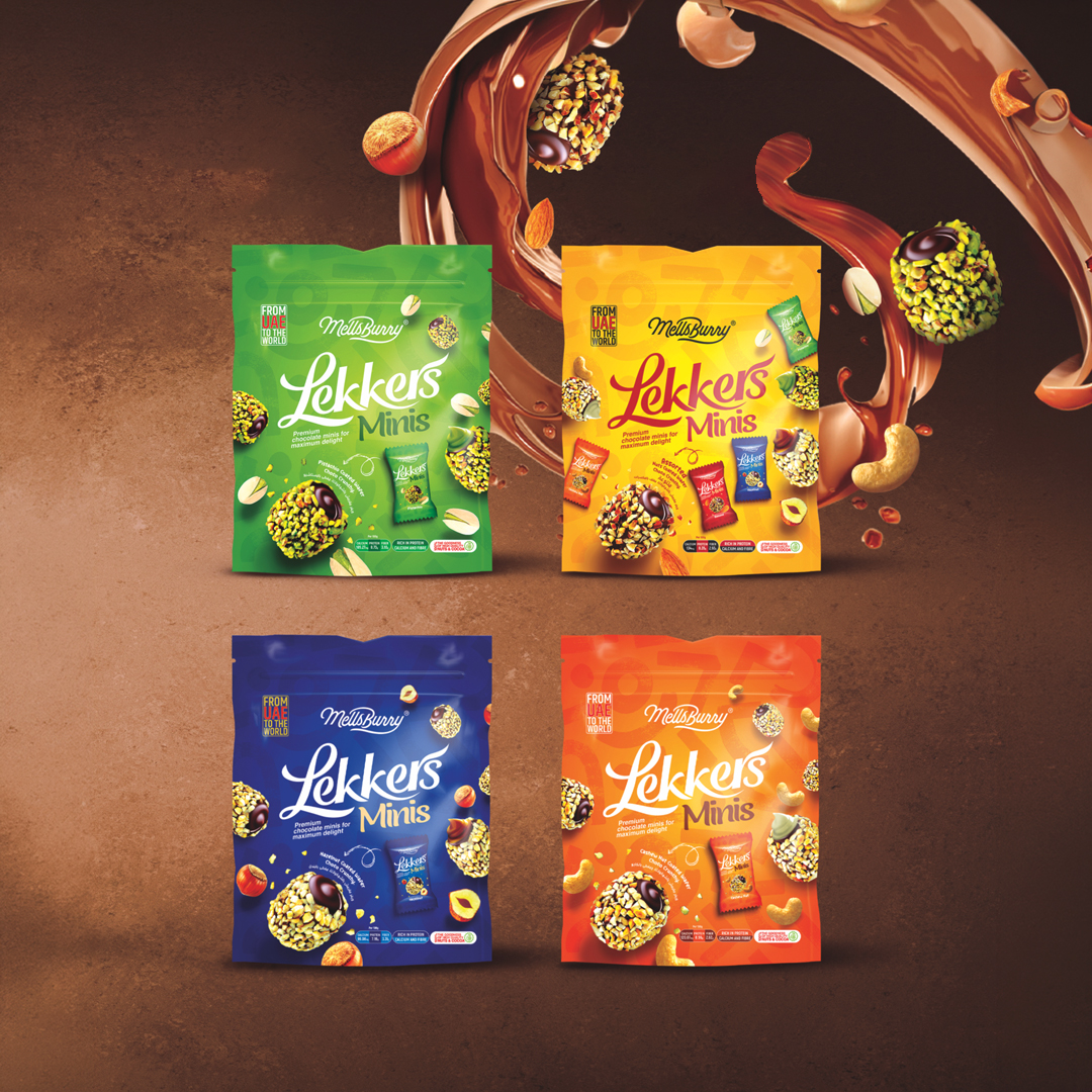 A premium product display showcasing the Lekkers Chocolate Wafer Collection by Olmec Sweets. The image features four colorful packs of Lekkers Minis date chocolates arranged against a rich chocolate background with flowing chocolate, pistachios, almonds, hazelnuts, and cashews. Each variety combines premium dates, crispy wafers, rich chocolate, and roasted nuts to create an indulgent confectionery experience. The vibrant packaging highlights multiple flavors, making the collection ideal for gifting, snacking, and sharing. Crafted with quality ingredients, the Lekkers Chocolate Wafer Collection represents Olmec Sweet's innovative range of premium date chocolates and gourmet treats in the UAE.